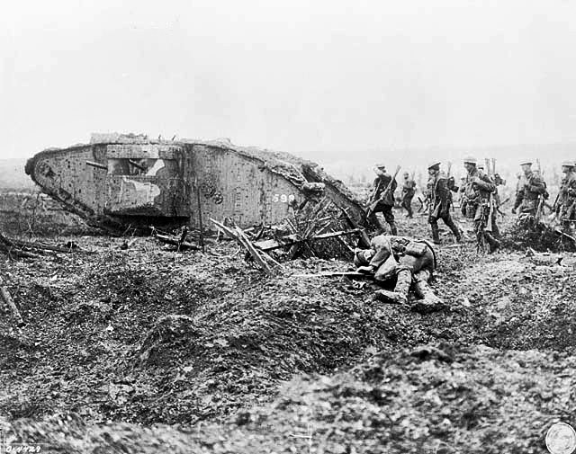 Canadian soldiers advance behind a Mark II heavy tank during the battle.