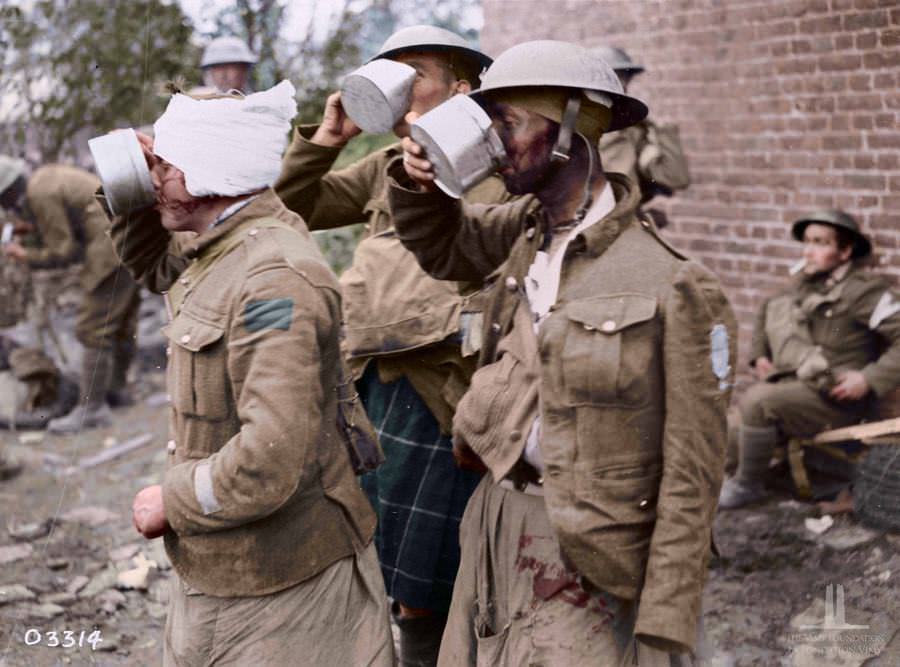 Canadian wounded enjoying a cup of tea at advanced dressing station during the advance East of Arras, October1918