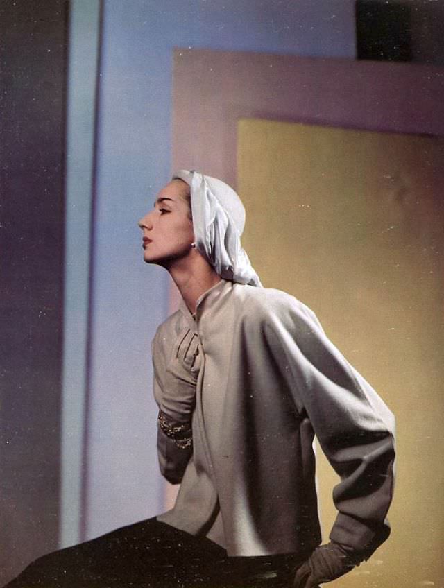 Toni Hollingsworth in a coat by Roxspun, hat by John Frederics, August 1945