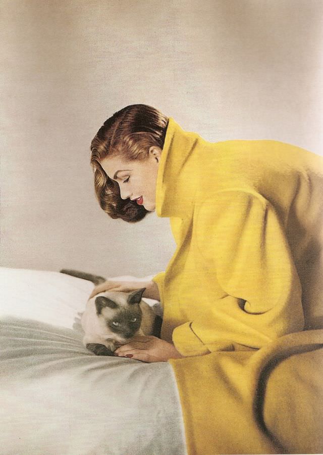 Inga is wearing a yellow wool coat by Original Modes, January 1947