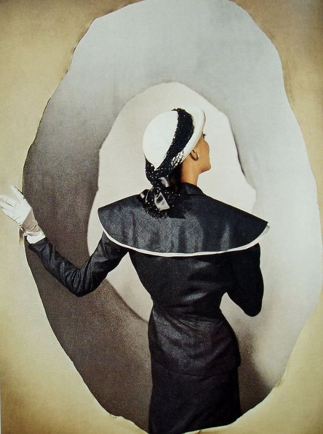 Model is wearing suit and hat by Hattie Carnegie, Louise Dahl-Wolfe's studio, March 1947
