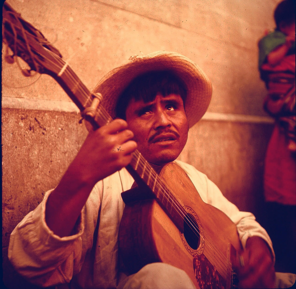 Man with guitar in Cuzco, Peru, 1960