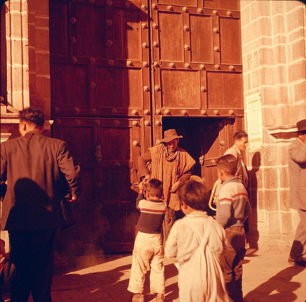 People at the door of church or cathedhral, Cuzco, Peru, 1960