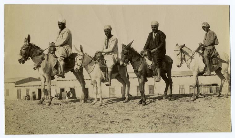 Men ridding on their donkeys