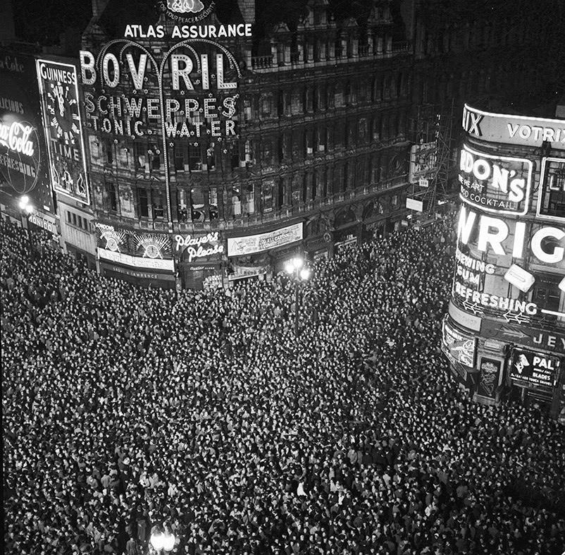 Revellers cram into London's Piccadilly Circus to count in the New Year, 1955