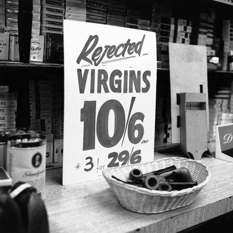 A sign offering a brand of briar pipes for sale at a reduced rate is seen at Coleman Cohen tobacco shop in Old Compton Street, 1966