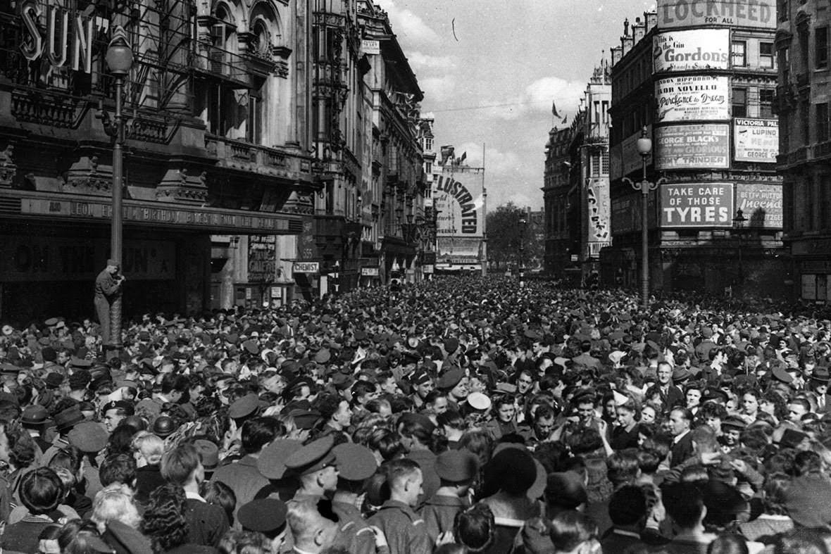 Crowds assemble in Piccadilly Circus to celebrate the news of Japan's surrender and the end of the Second World War, 1945