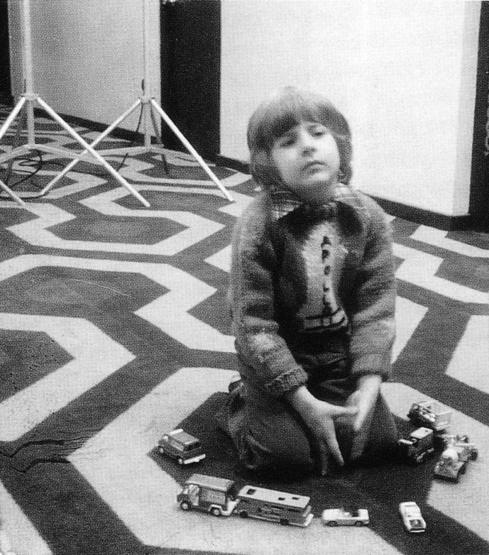 Actor Danny Lloyd (Danny Torrance) on set.