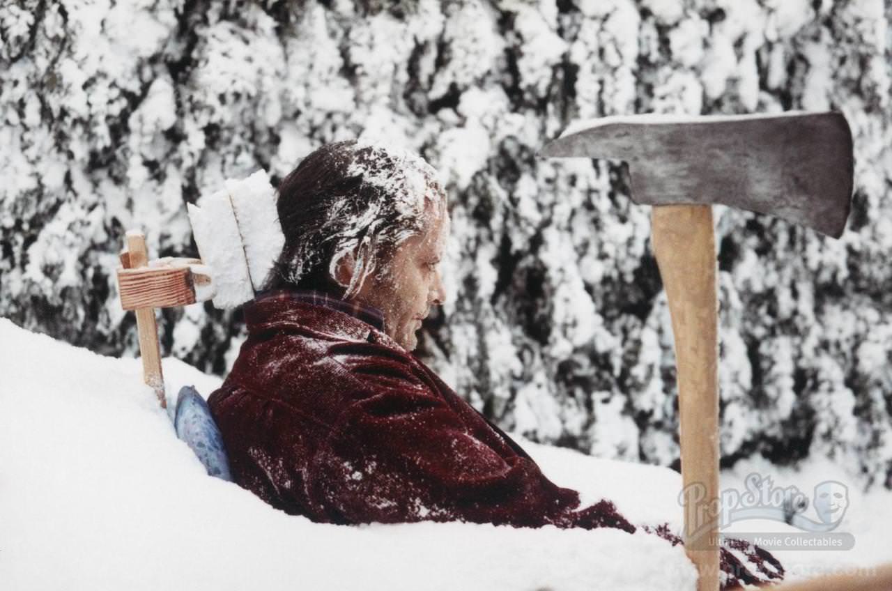 Jack Nicholson posing for his final moment frozen in the snow. This side angle reveals the crude bracing system of wood and styrofoam that was built to hold Nicholson as still as possible for the lengthy shot.
