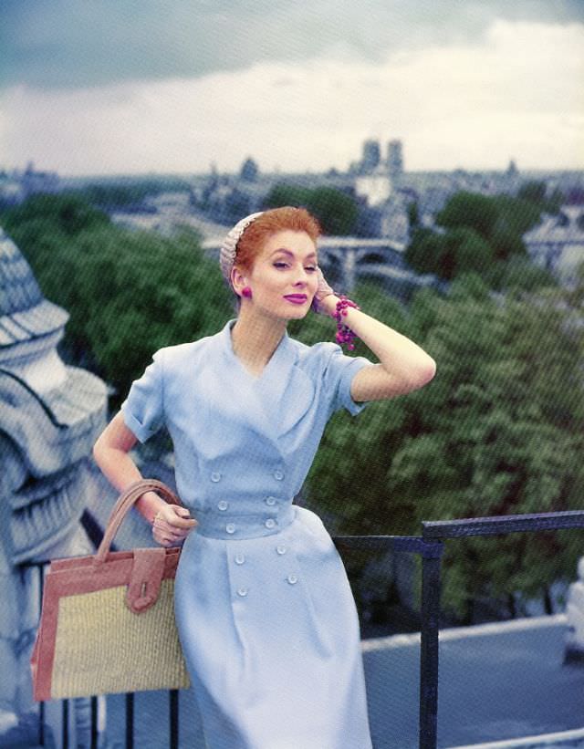 Suzy Parker in dress by Jean Patou on the roof of the Louvre Museum, Elle, July 1954