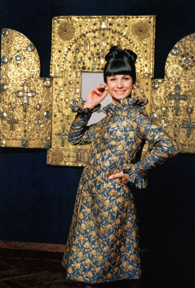 Mickey in peacock blue and gold brocade evening coat, Elle, October 1964