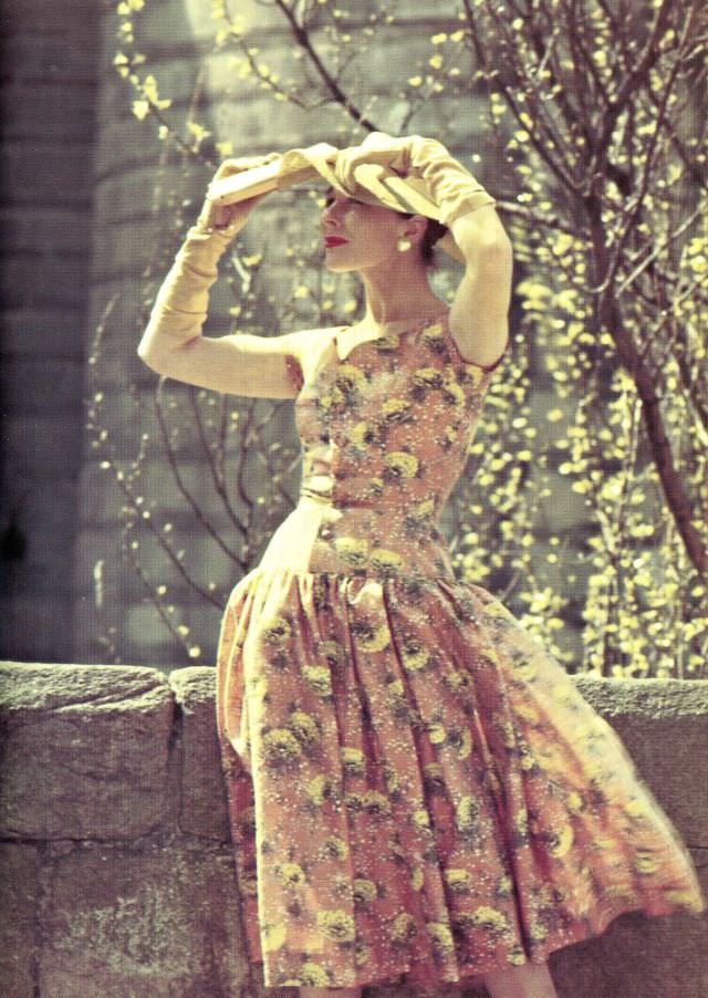 Bettina poses in an embroidered dress by Lempereur, photo Elle, May 30, 1955