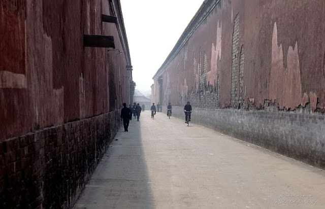 Beijing. Pedestrians and bicycle riders in the Forbidden City