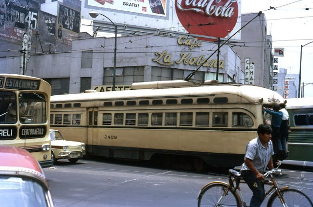 Mexico City. PCC No. 2409 with youths riding on bumper near the Railway Station