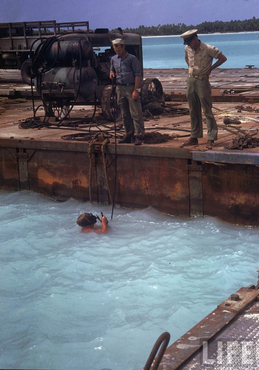 American sailors working in an artificial harbor on Tarawa during WWII.