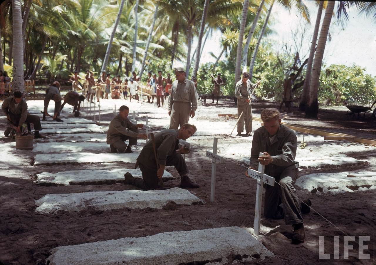 Group of American soldiers tending to a graveyard on Tarawa during WWII.