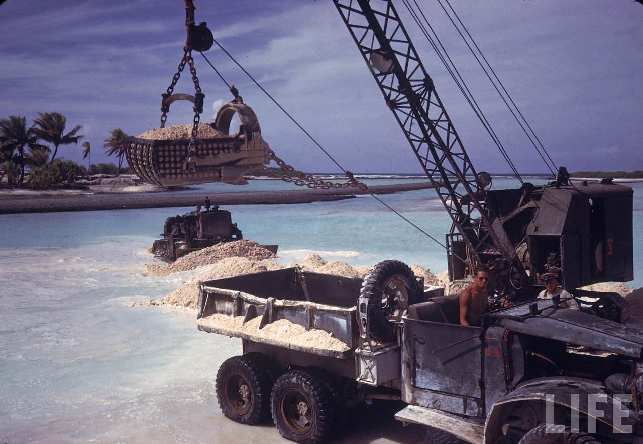 American servicemen building a breakwater on Tarawa during WWII.