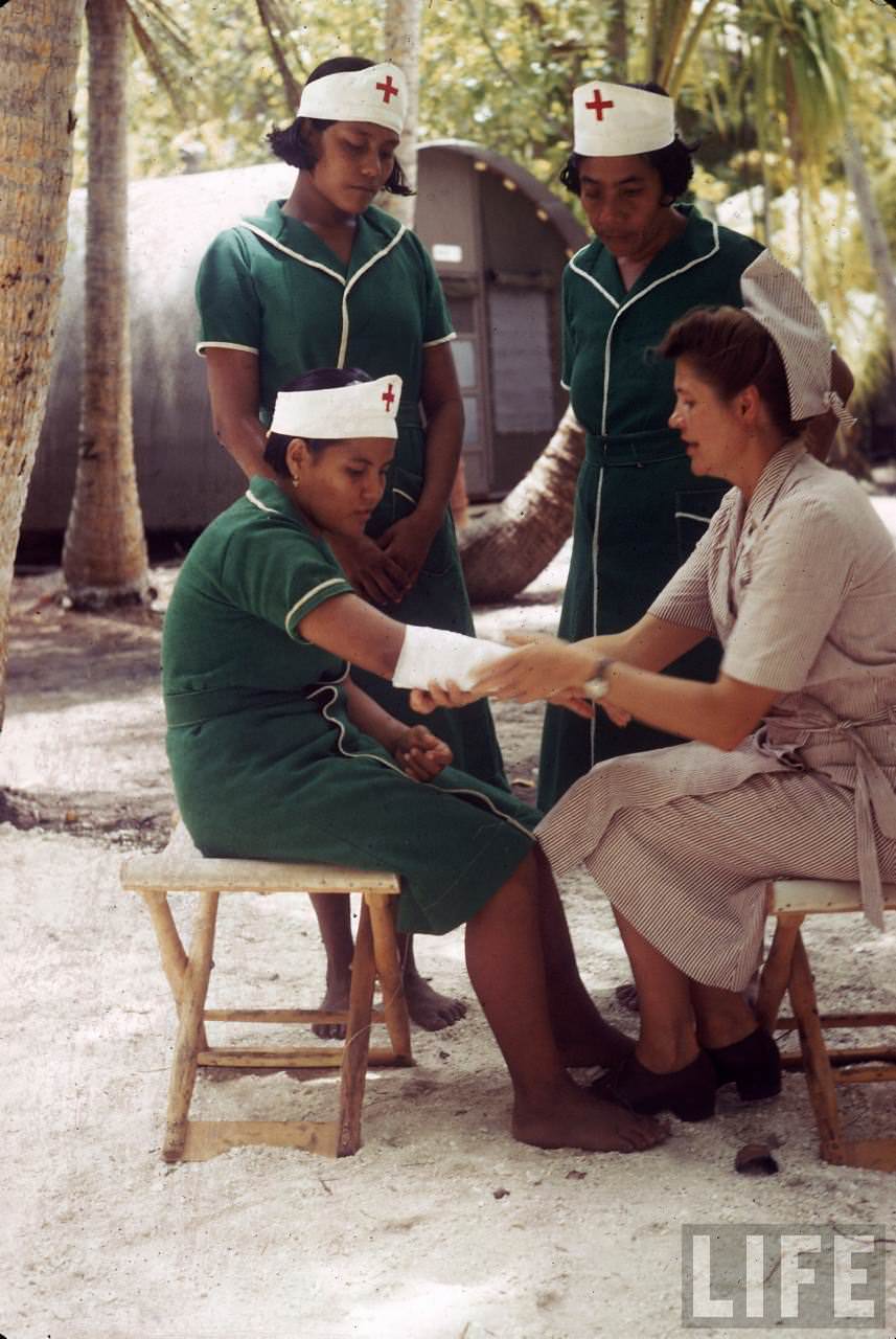 Group of local women being trained as nurses on Tarawa during WWII.
