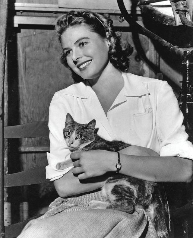 Ingrid Bergman holding her cat, 1940s