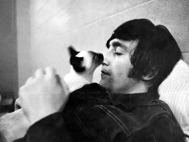 John Lennon with his cat, 1965