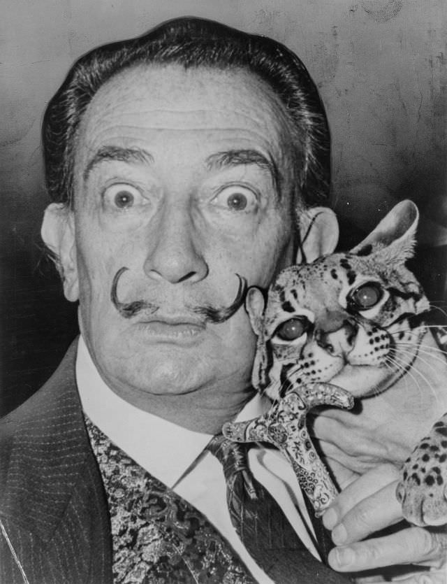 Salvador Dali with his cat