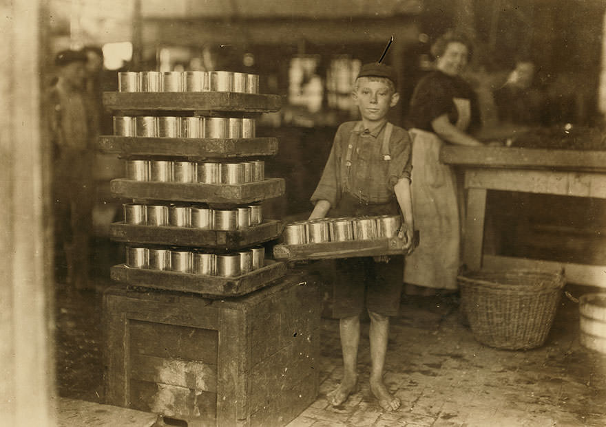 One of the small boys in j. S. Ferrand p[ac]king co. And a heavy load. J. W. Magruder, witness. Location: Baltimore, Maryland