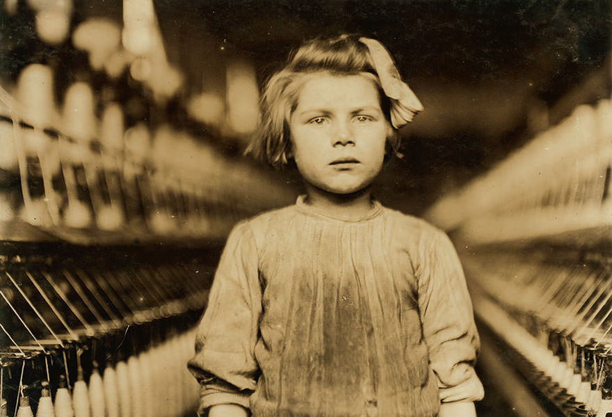 A little spinner in globe cotton mill. Augusta, The overseer admitted she was regularly employed. Location: Augusta, Georgia