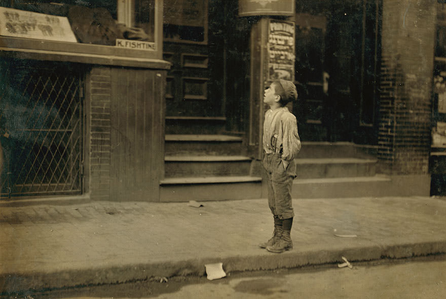 “Fire- fire – i want to make the fire.” An Italian boy on Salem street Saturday morning, offering to make fires for Jewish people. Location: Boston, Massachusetts