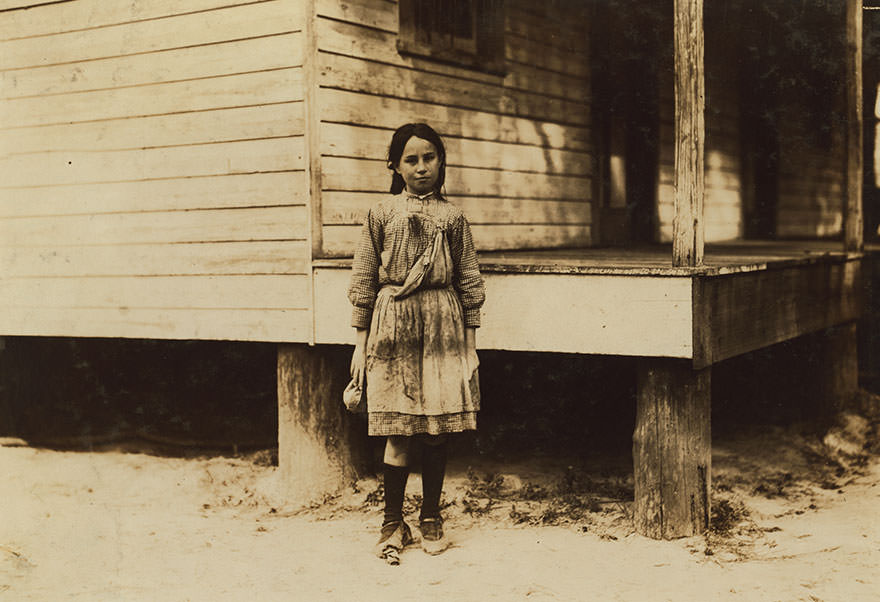 Lillian Dambrinio, an eleven-year-old shrimp picker in peerless oyster co. She is an American and lives here. Says picking makes her hands sore. Location: bay st. Louis, Mississippi