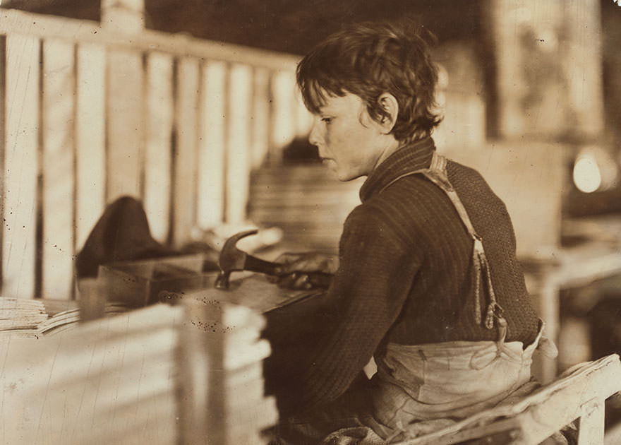 Boy making melon baskets, a basket factory, Evansville, ind. Location: Evansville, Indiana