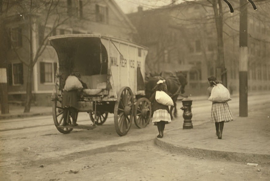 Girls working on ice wagon. Location: New York