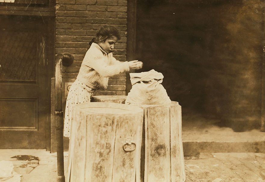 Picking over ash barrels. Boston, mass., oct. 1909. L.w. Location: Boston, Massachusetts