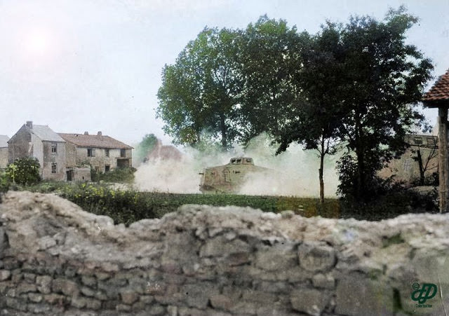 Western Front, German A7V tanks drive through a village near Rheims in 1918