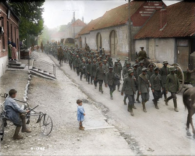 Boche prisoners captured by Canadians on Hill 70 are paraded through town, August, 1917
