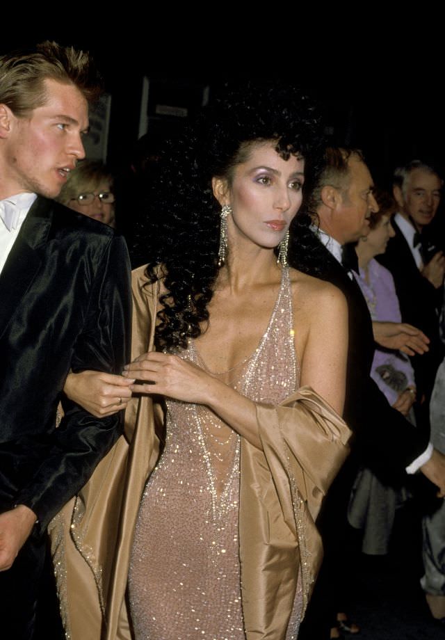 Cher with Val Kilmer at the 56th Annual Academy Awards. Photo by Ron Galella, 1984