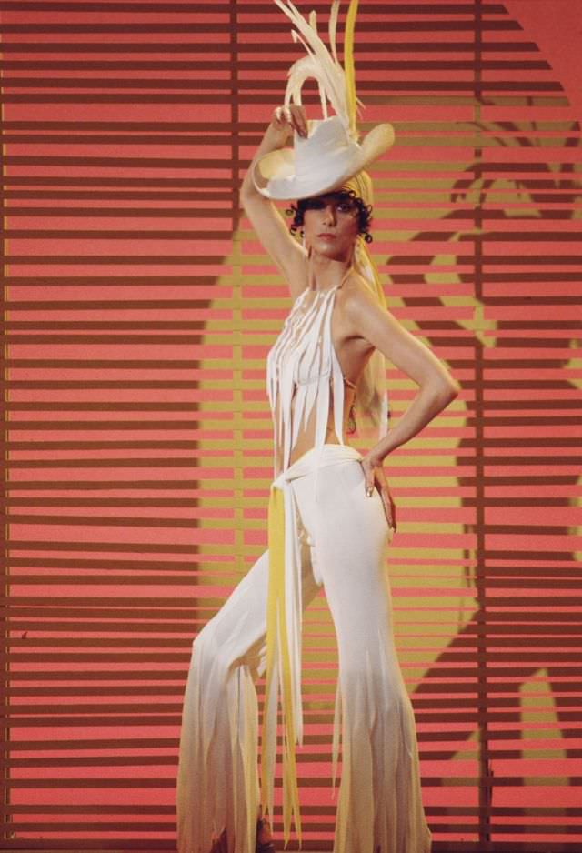 Promotional portrait of Cher, dressed in fringed outfit, for the television variety show 'The Sonny and Cher Comedy Hour, 1972