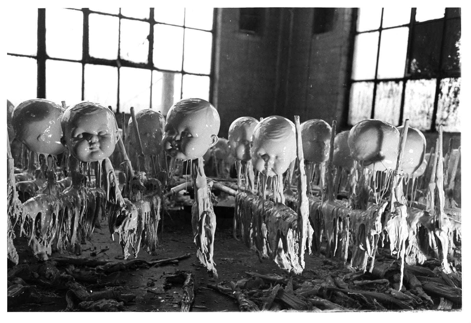 The dripping doll heads of a toy factory, circa 1900