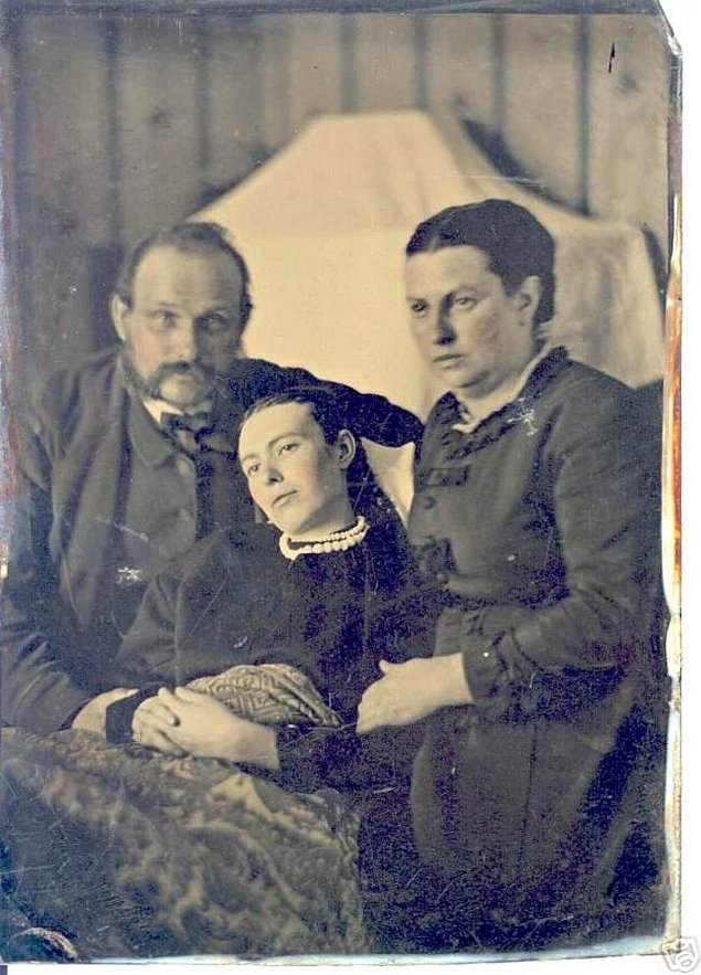 Parents posed with their dead daughter