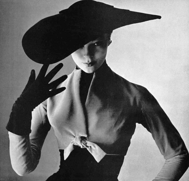 Ivy Nicholson in beige velvet short bolero over wool dress by Christian Dior, 1951