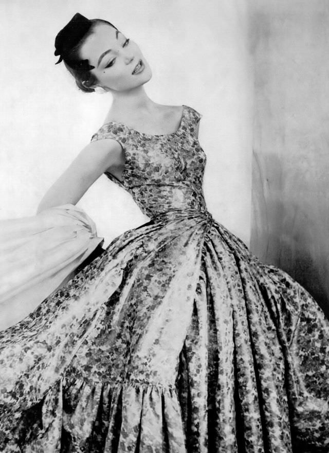 Ivy Nicholson in floral print silk or taffeta dress copied from original design by Givenchy, Vogue, April 1, 1954