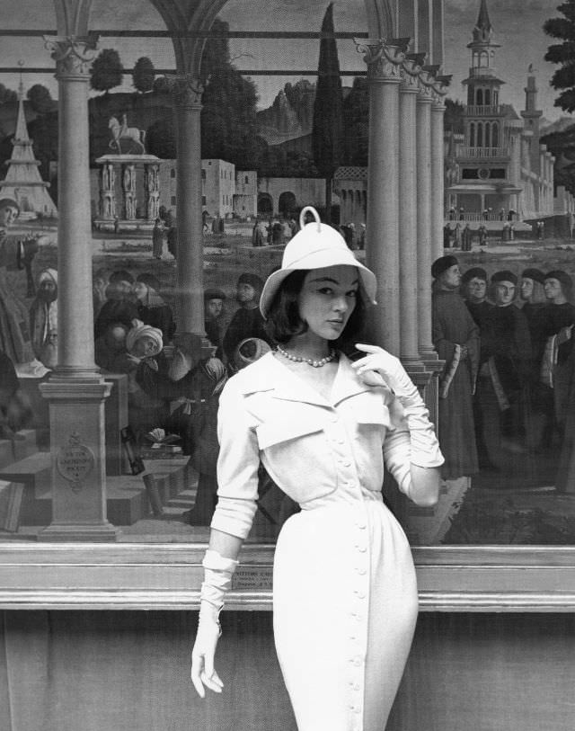 Ivy Nicholson in slim jersey dress and soft-brimmed hat by Jacques Fath at the Musèe de l'Orangerie, ELLE, March 29, 1954