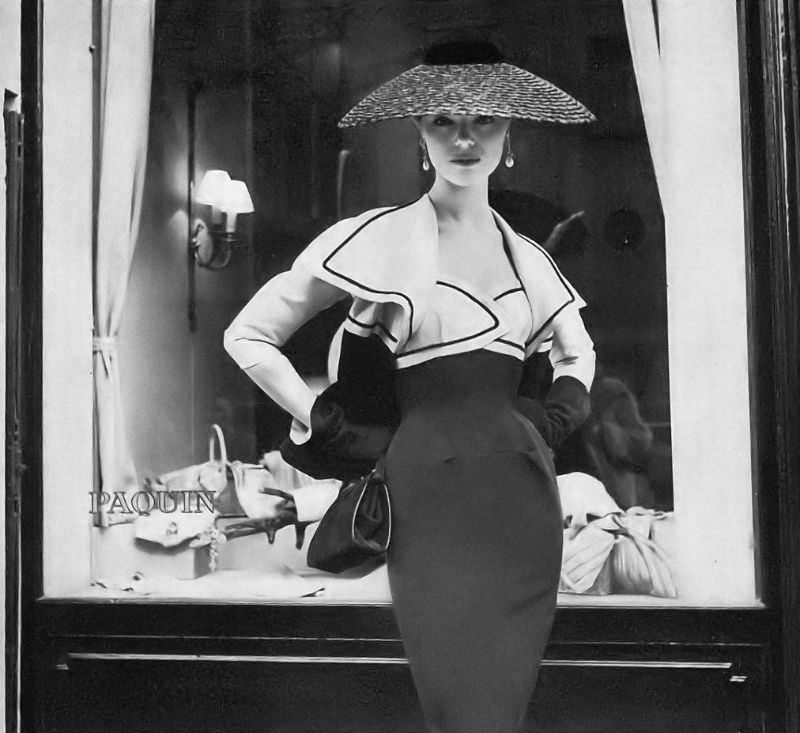 Ivy Nicholson in late-day dress and short jacket of black and white faille designed by Paquin for Vogue Pattern 1299, Paris, Vogue, June 1, 1955
