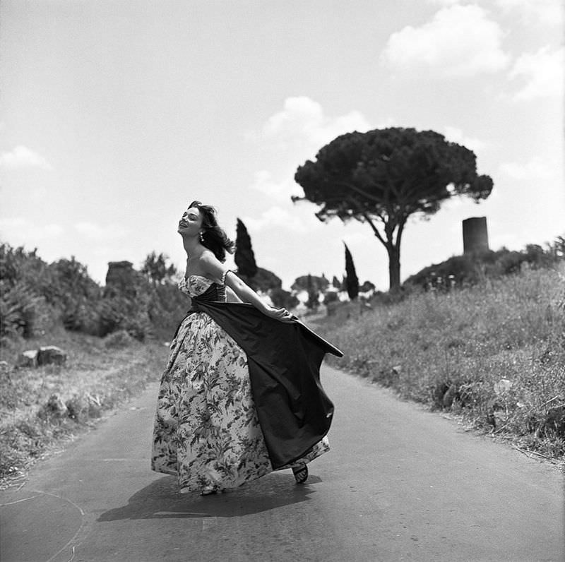 Ivy Nicholson in evening gown by unidentified Italian designer, Appian Way, Rome, 1956