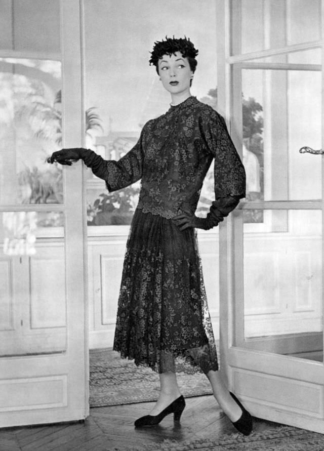 Ivy Nicholson in tortoise shell lace dress in straight line and simple cut, the skirt falls in folds from the hip by Balenciaga, 1951