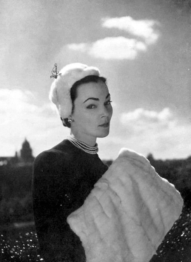 Ivy Nicholson in white ermine cap by Legroux, ermine muff by Maurice Kotler, 1951