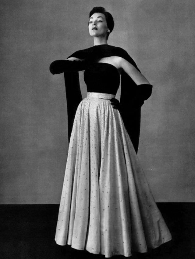 Ivy Nicholson in white velvet skirt embroidered with beads worn with navy jersey top and stole, by Jean Dessès, 1951