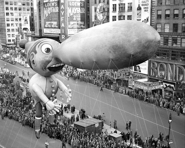 Balloons float down Broadway in thirteenth annual Macy's Thanksgiving Day parade, November 25, 1937.