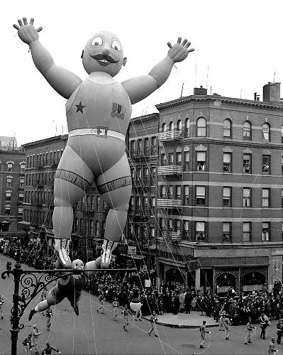This prize-winning balloon of two acrobats was designed by Rudolf Lopez, 12, of Brooklyn and joined the parade in 1938. It's shown here passing 106th St. and Central Park West.