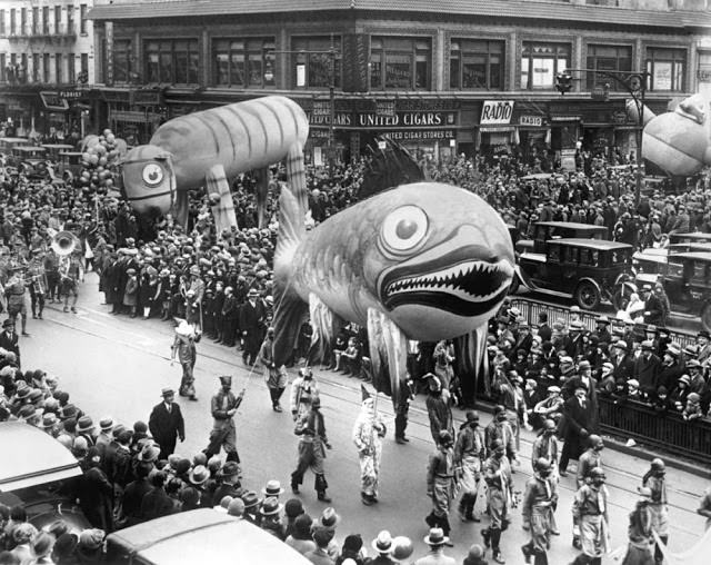 A fish balloon is released as the parade nears its end on Broadway in 1929. They were filled with helium and will drift for a week, with a $100 prize awarded for each one recovered.