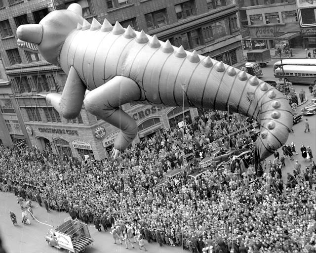 A helium-filled alligator is hauled through Times Square during Macy's Thanksgiving Day parade in 1949. The parade drew an estimated 2,000,000 spectators.